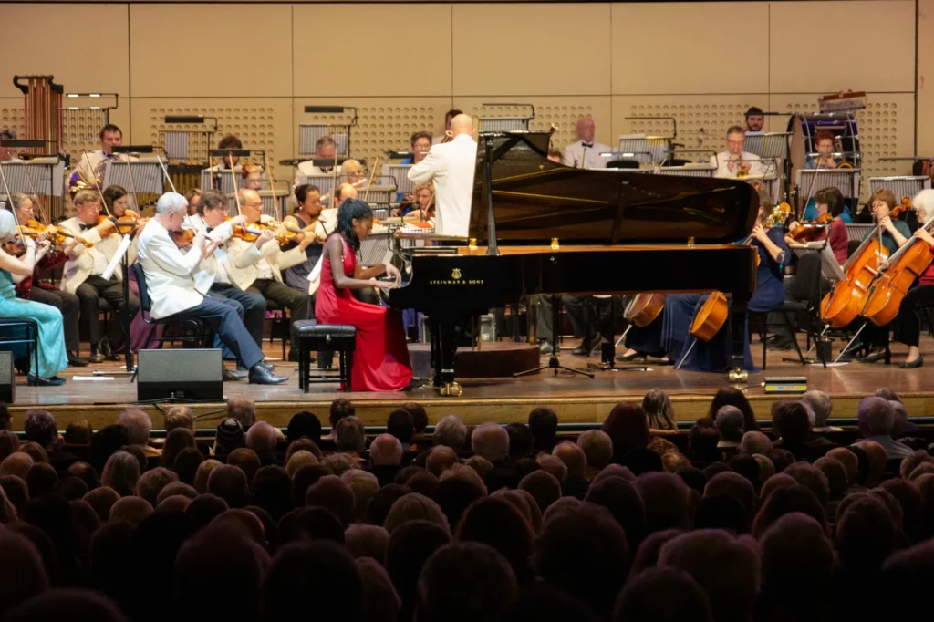 A full house (over 2200 people) present for the New Year’s Eve Sinfonia Viva concert at the Royal Concert Hall in Nottingham. BBC Young Musician of the Year Keyboard finalist Jeneba Kanneh-Mason is playing on stage with the orchestra.