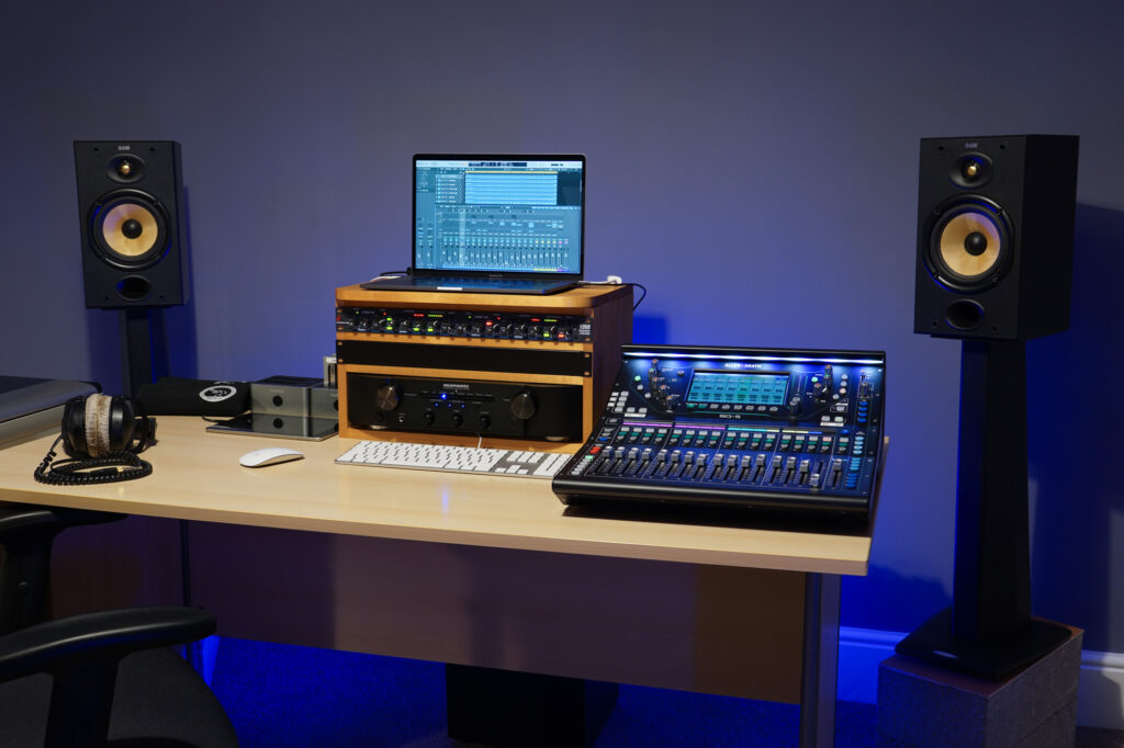 Photograph of the Capybara Sound studio mixing/mastering control position, with B&W monitoring, Apple MacBook Pro running Logic Pro, Allen & Heath SQ-5 mixing console and some Beyerdynamic DT-770 Pro headphones.